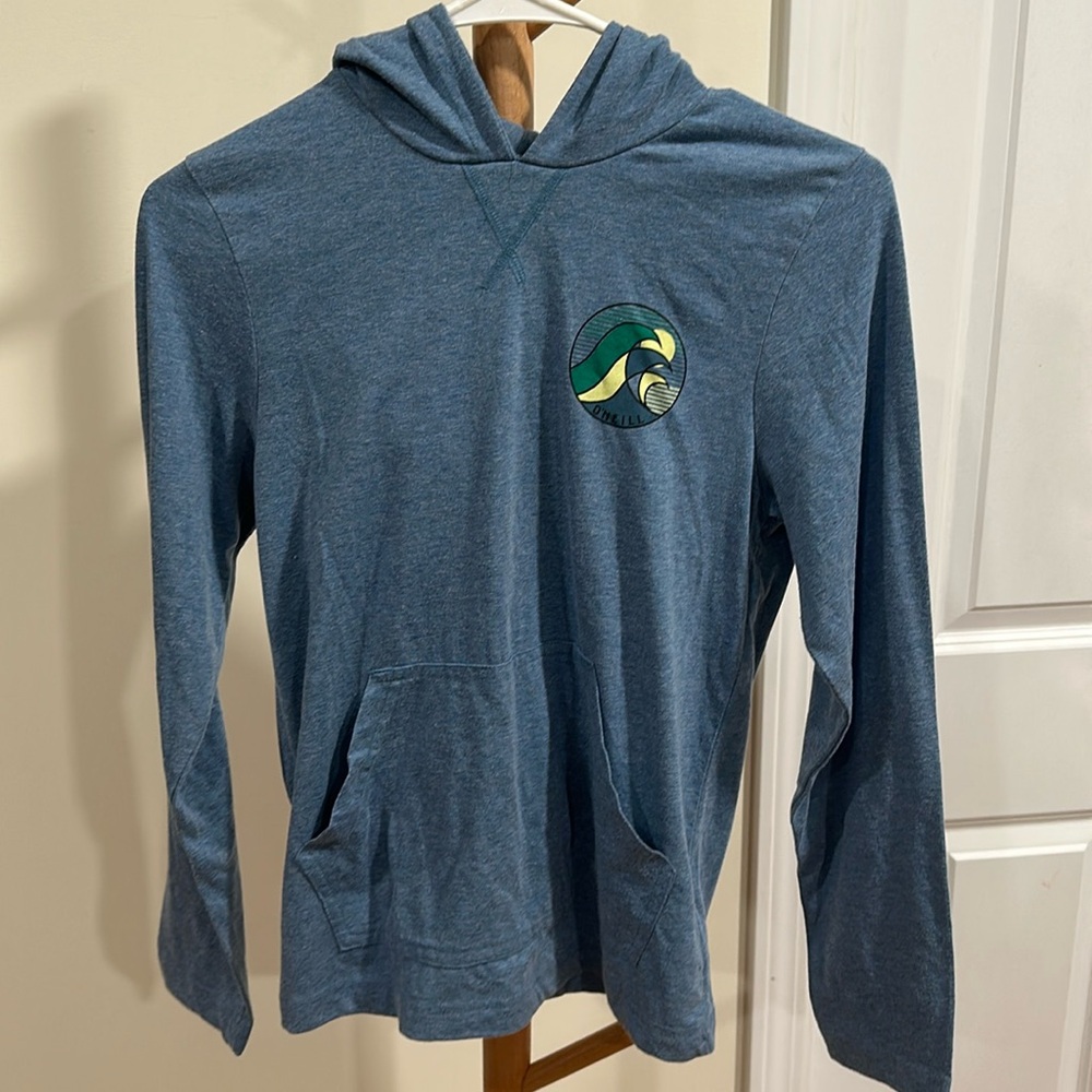 Boys O’Neil Long Sleeve shirt with hoodie and front pocket.
